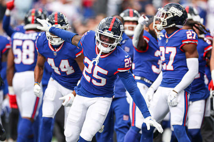 Oct 22, 2023; East Rutherford, New Jersey, USA; New York Giants cornerback Deonte Banks (25) celebrates after an interception against the Washington Commanders during the first half at MetLife Stadium.